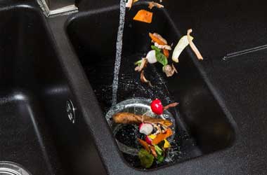 Food Falling Into a Garbage Disposal in Houston