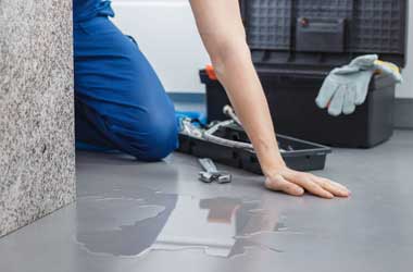 Houston Plumber Discovering Water Leaked Onto the Floor