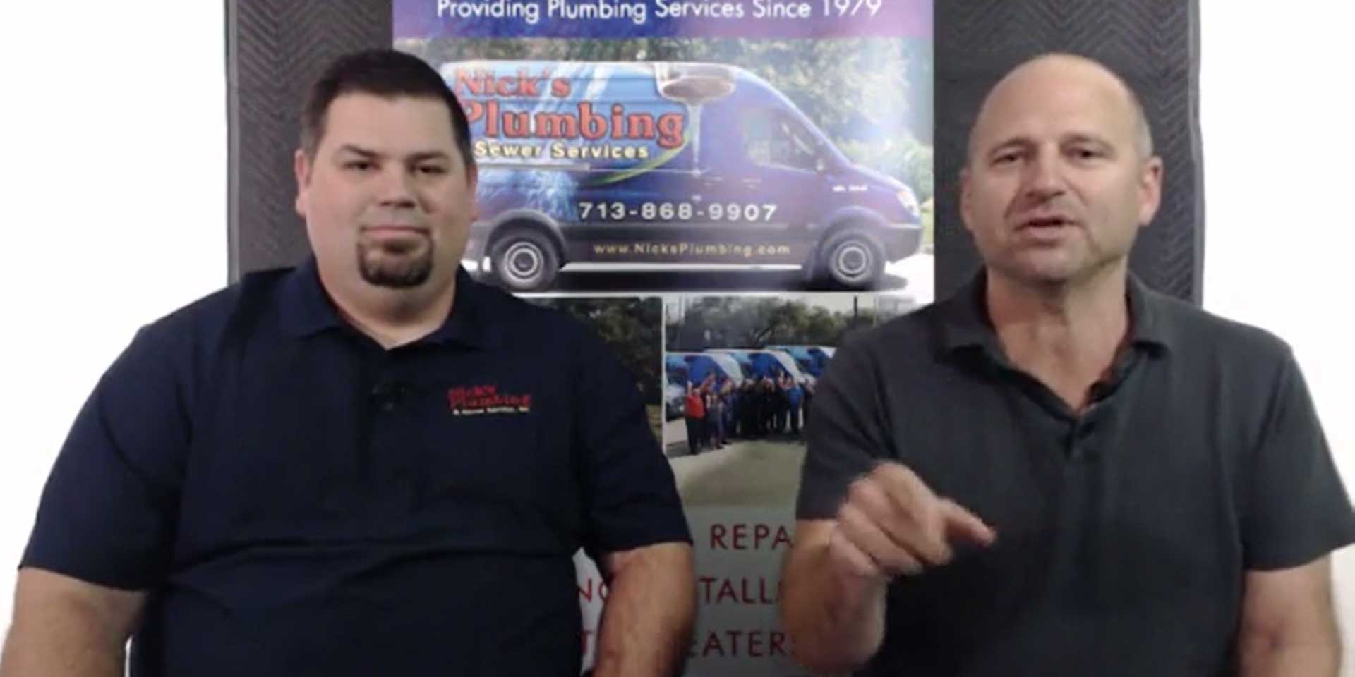 Two of Nick's Plumbing Experts in Houston Talking and Smiling
