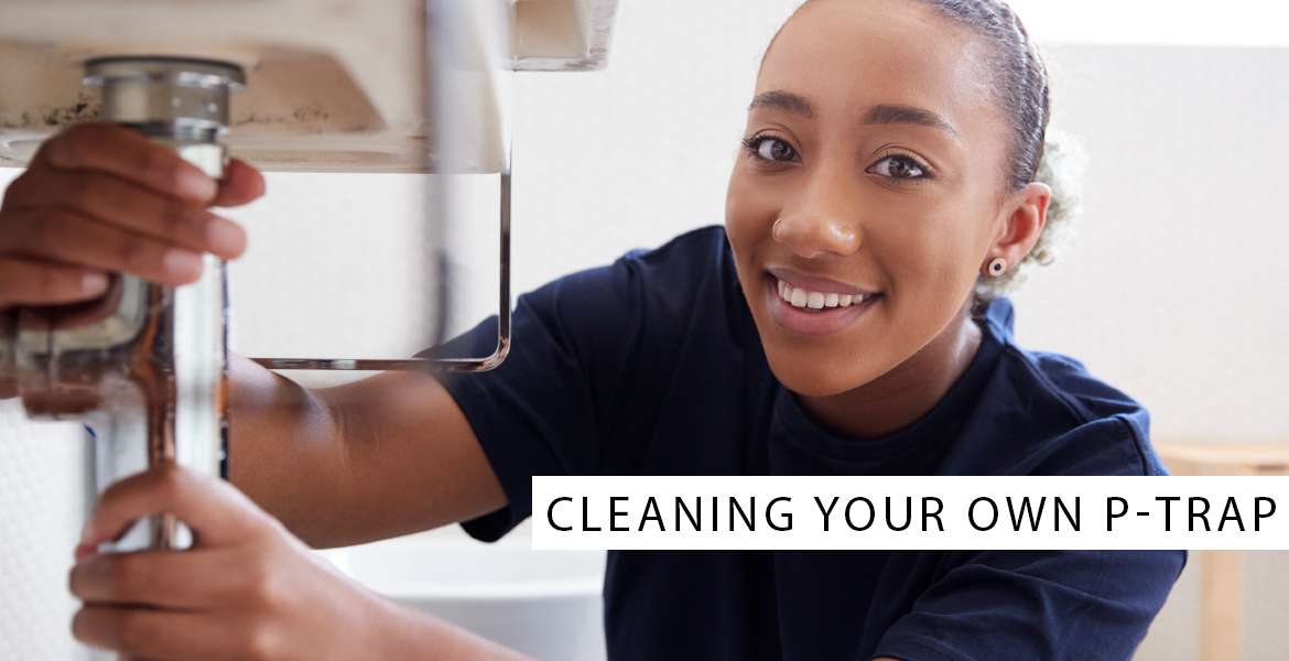 woman cleaning the p-trap at home