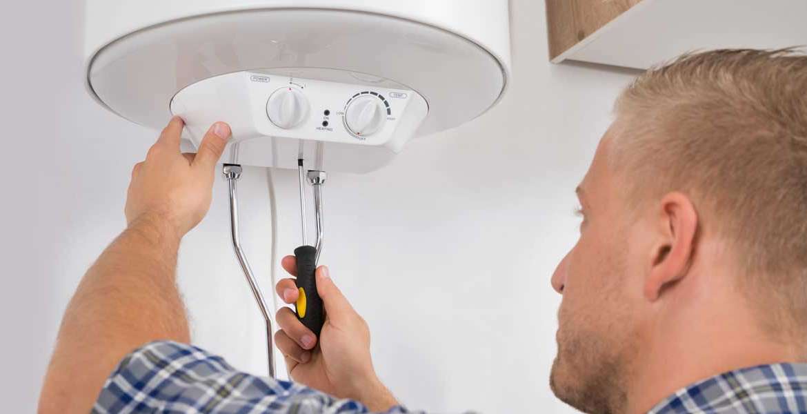 Professional Plumber Repairing a Water Heater