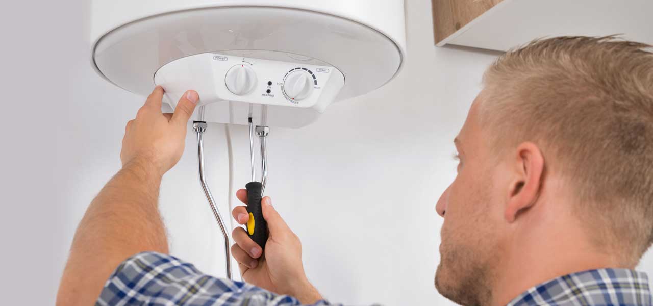 Professional Plumber Repairing a Water Heater